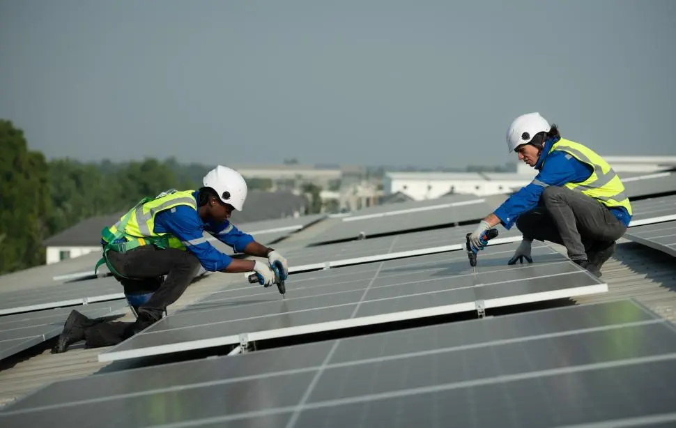 Solar technicians installing rooftop solar panels in South Africa